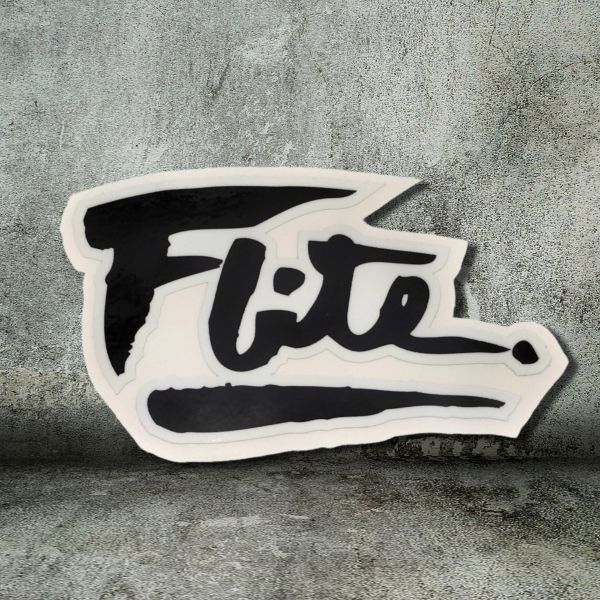 black flite logo sticker on concrete