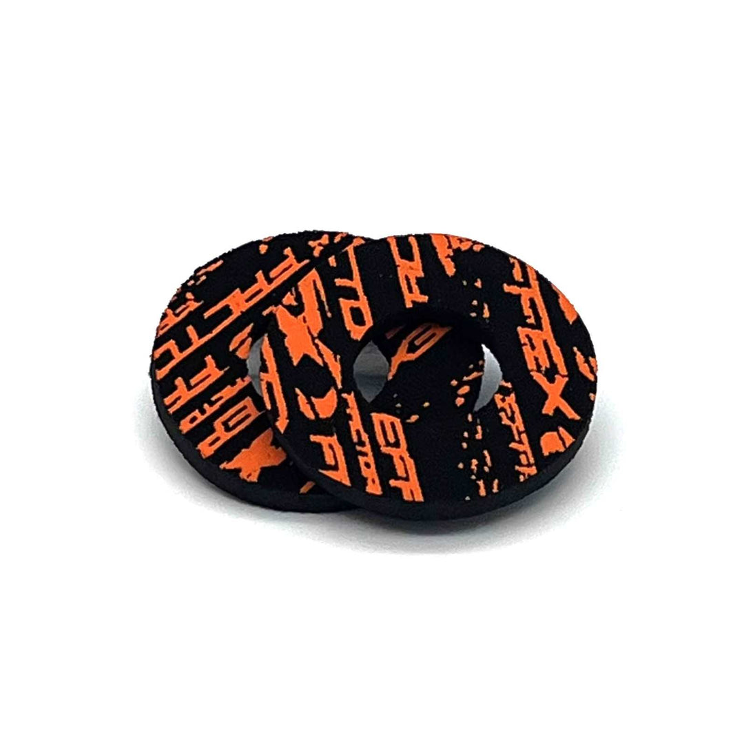 Black round motorcycle grip with orange graphic.