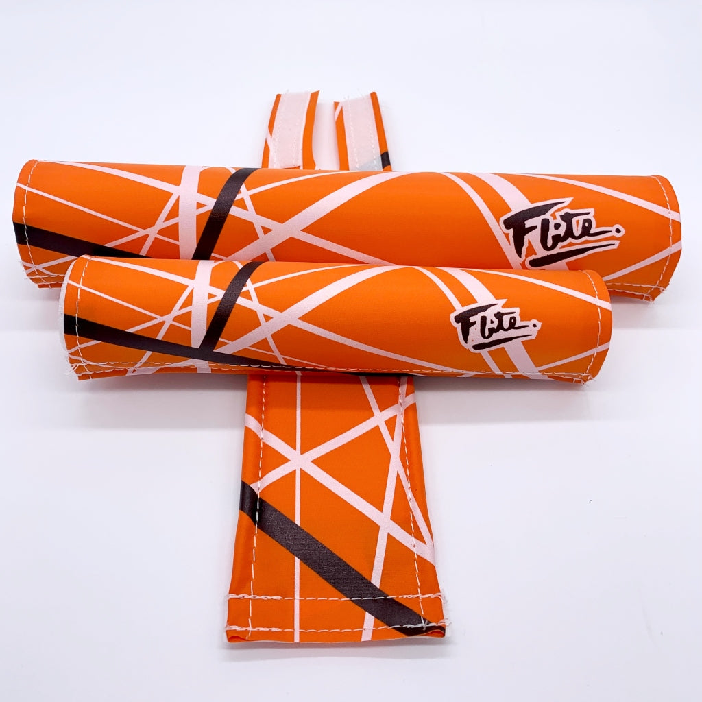 Jump! BMX Pad Set By Flite 3 piece set frame bar stem pad Red with white black stripes music printed on smooth nylon made in the USA Orange